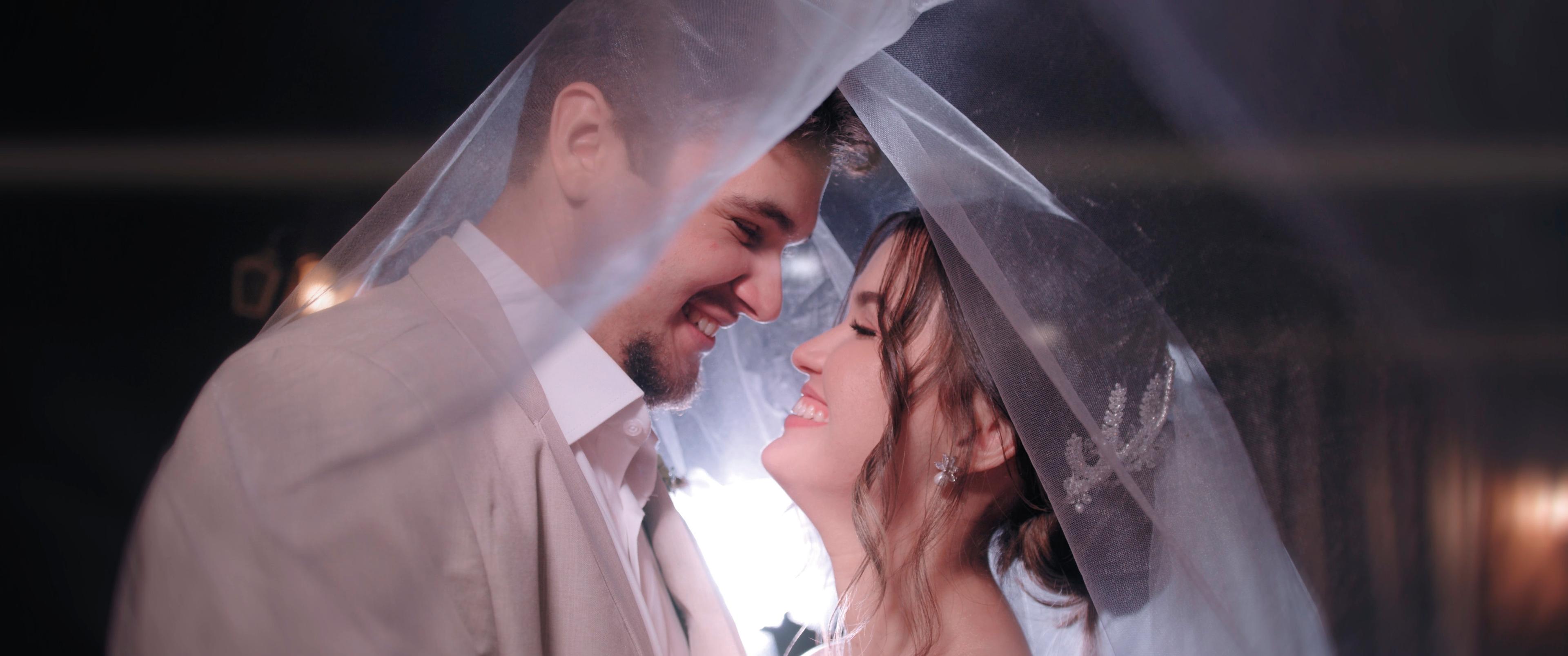 Couple beneath the veil